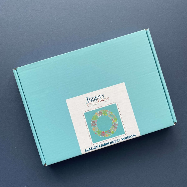 Sea shells embroidery kit packaged in a pretty turquoise blue box with labelling