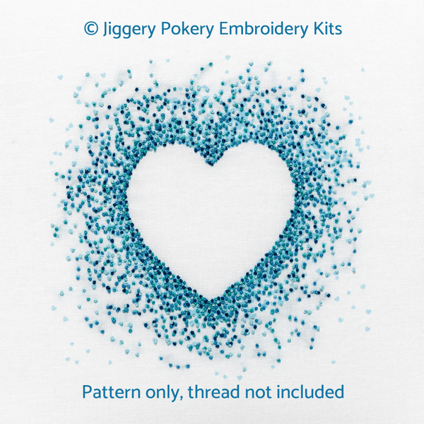 Blue hearts embroidery pattern showing a negative space heart created by French knots in pale blue, aquamarine, turquoise and blue