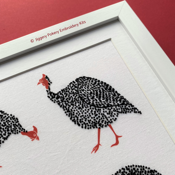 Guinea fowl bird embroidery pattern on red