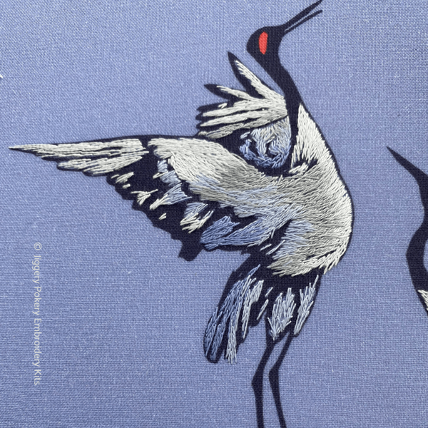 Creative thread painting close-up of dancing crane bird