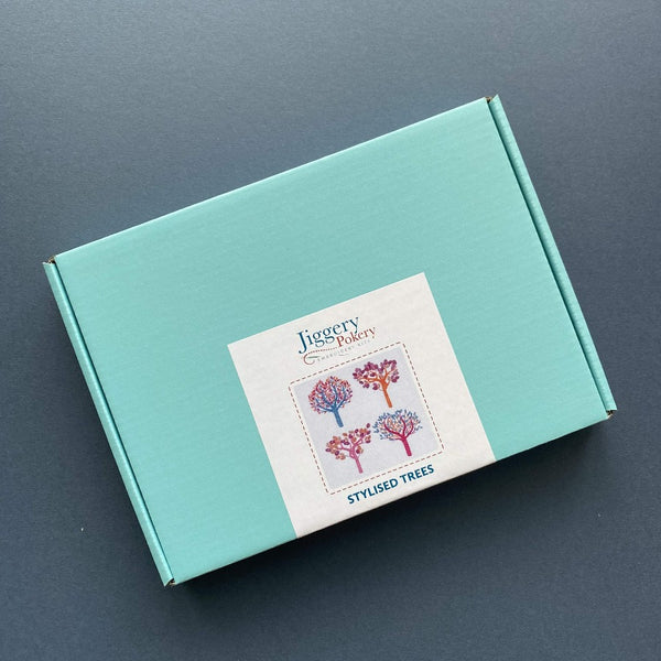 Autumn trees embroidery kit packaged in a pretty turquoise blue box with labelling