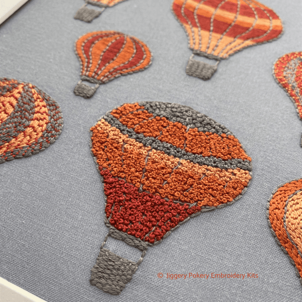 Hot air balloons embroidery design close-up of balloon stitched with French knots