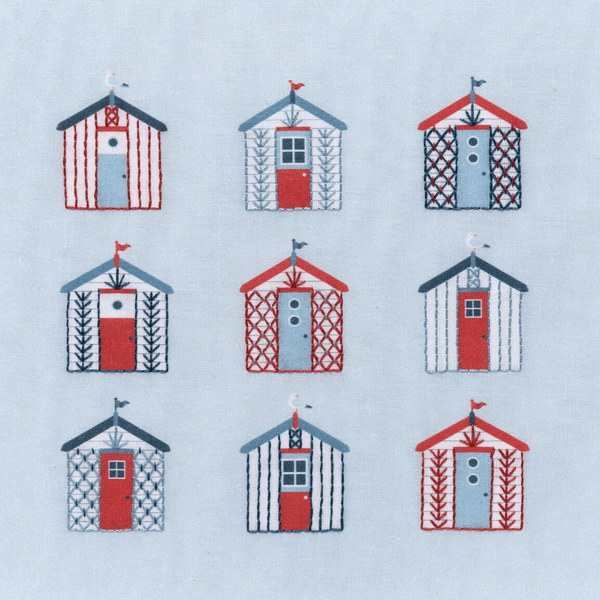Beach embroidery kit showing 9 beach huts using simple embroidery stitches. The DMC thread colours are red, dark blue and blue on a printed pale blue-grey background