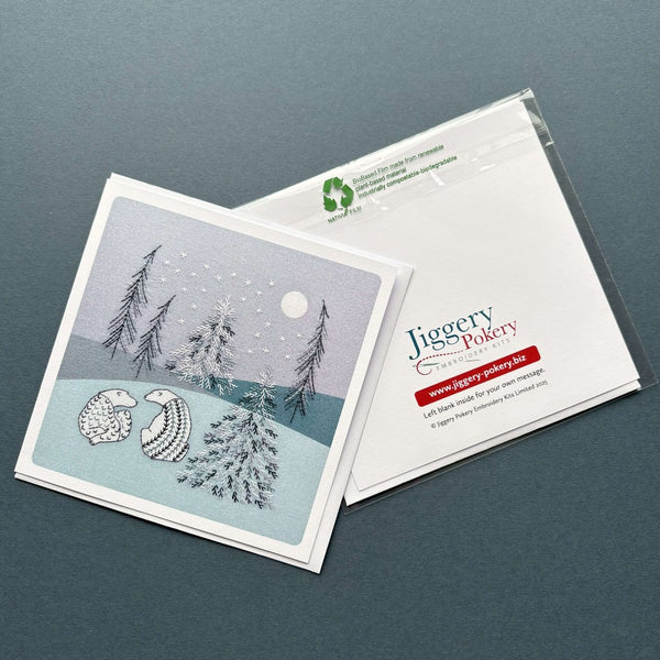 A printed greetings card featuring the polar bears embroidery design by Jiggery Pokery. Also shows the back of the card and envelope.
