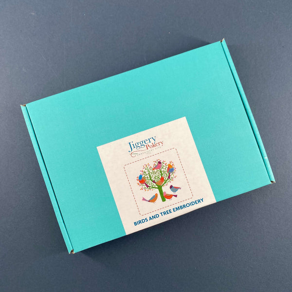 The birds embroidery kit comes in a pretty turquoise box with a label showing the contents