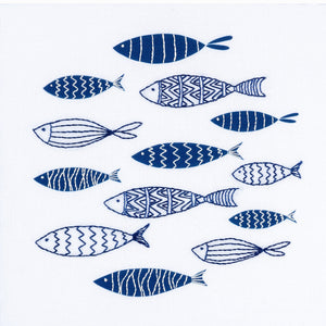 Fish embroidery kit showing a shoal of small navy blue and white fish. Beginner embroidery.