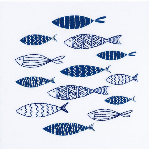 Fish embroidery kit showing a shoal of small navy blue and white fish. Beginner embroidery.