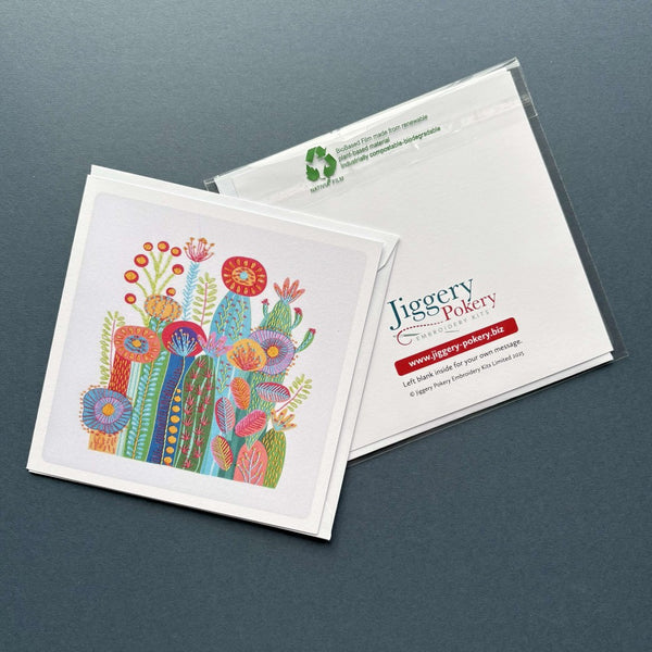 A printed greetings card featuring the cactus on white embroidery design by Jiggery Pokery. Also shows the back of the card and envelope.