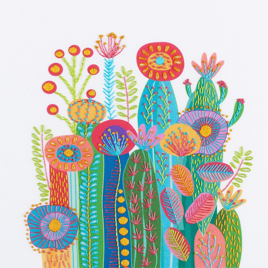 Cactus embroidery kit on a white background showing a cluster of brightly coloured cactuses and flowers in maximalist style