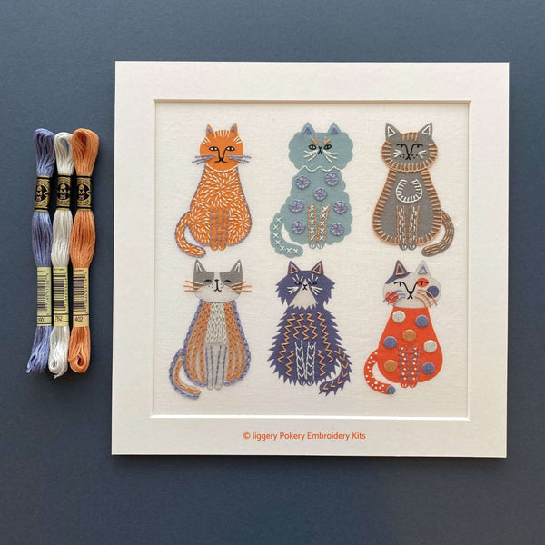 Cats embroidery in white mount with DMC threads in blue, orange and grey