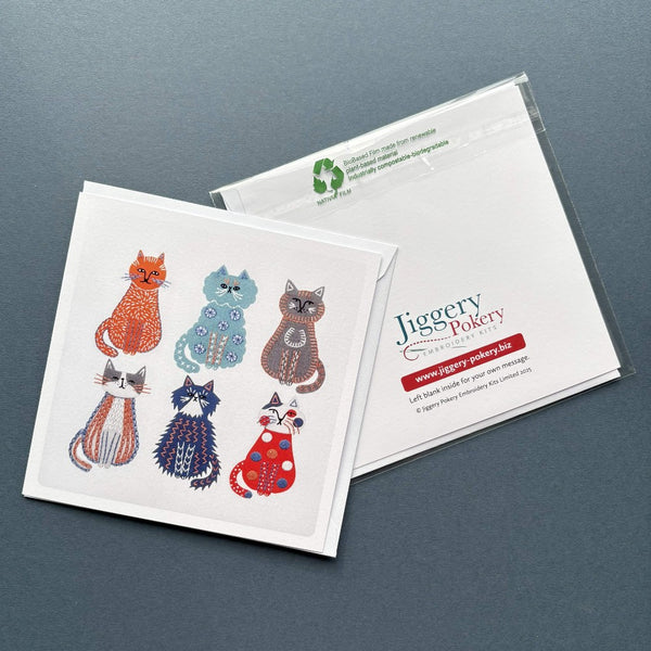 A printed greetings card featuring the cats embroidery design by Jiggery Pokery. Also shows the back of the card and envelope.