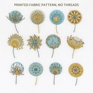 Embroidery pattern showing 12 dandelion seedheads stitched in mustard gold, blue, linen and brown.