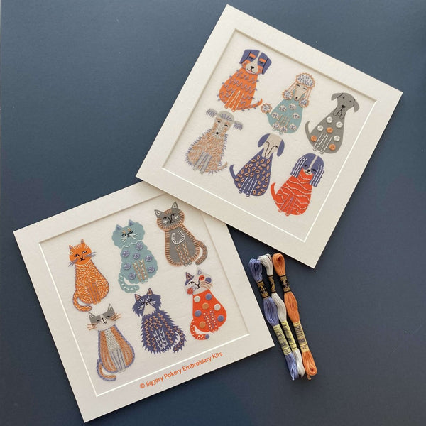 Dog and cat embroideries shown with blue, orange and grey DMC threads