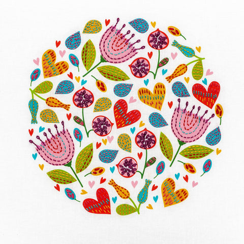 Modern floral embroidery kit with bright flowers and heart shapes in red, yellow, pink, purple and green suitable for beginners.