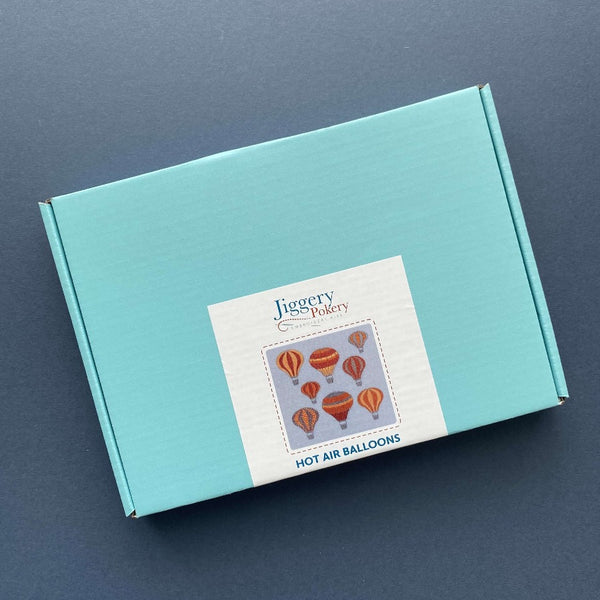 Balloons embroidery kit packaged in a pretty turquoise blue box with labelling