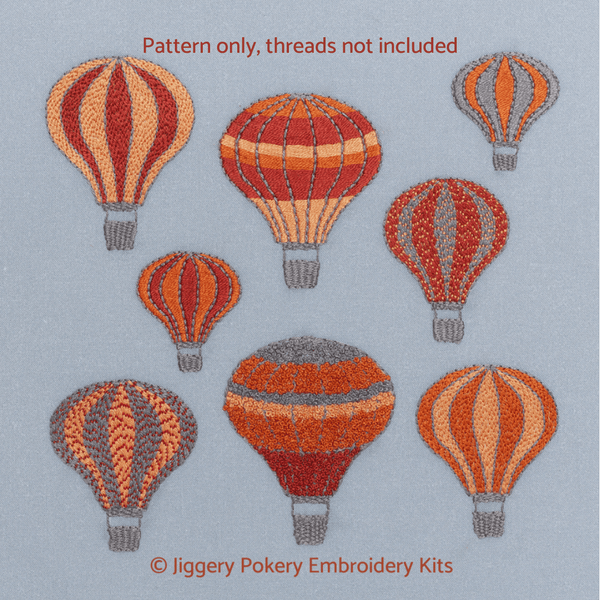 Hot air balloons embroidery pattern showing a group of brightly coloured balloons against grey skies
