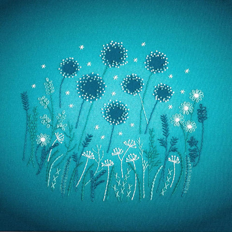 Modern embroidery flowers kit creates a night garden of flowers and grasses under moonlight and stars.