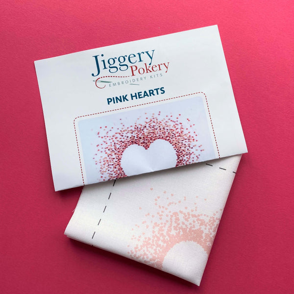 Jiggery Pokery pink hearts embroidery pattern plus instructions shown on a pink background
