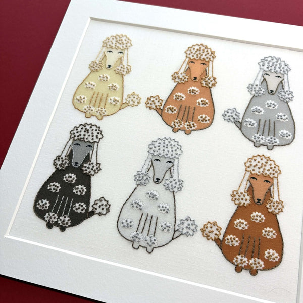 A close-up of the poodles embroidery and the 6 stitched poodles.