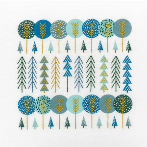 Scandinavian trees embroidery kit showing groups of trees stitched in navy, aqua, gold and green DMC thread colours