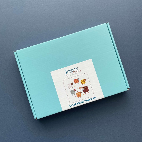 Sheep embroidery kit packaged in a pretty turquoise blue box with labelling
