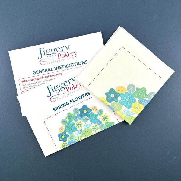 Jiggery Pokery embroidery pattern with spring flowers design printed on fabric plus general instructions and stitch instructions.