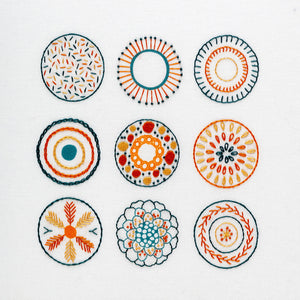 The embroidery stitch sampler shows you how to do 10 popular embroidery stitches. The design is completed in apricot, burnt orange and dark teal DMC thread colours.