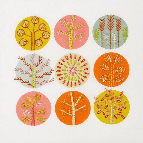 Trees embroidery kit using hot summer colours in pink, lime green, orange and grey