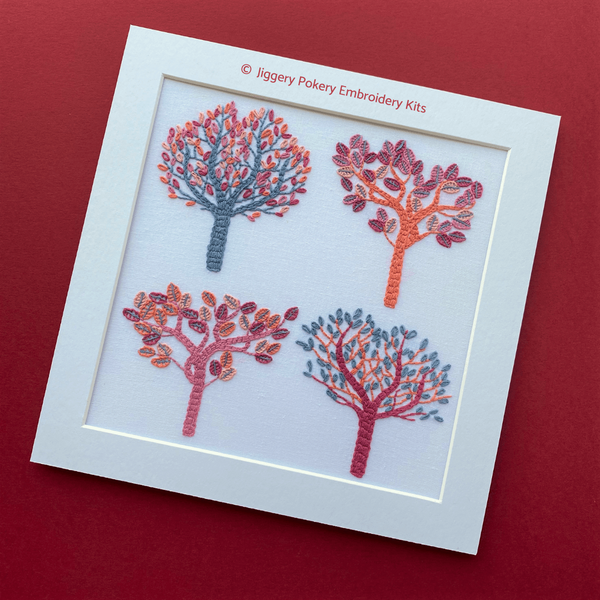 Autumn embroidery of four trees in modern colours in mount