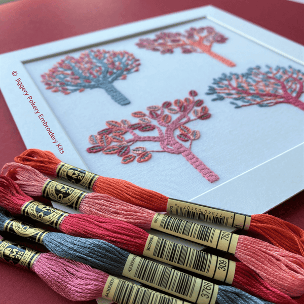 Autumn embroidery mounted, shown with 5 skeins of DMC threads