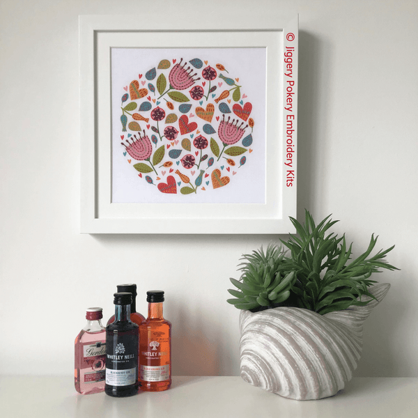 Beginners floral embroidery kit framed on wall