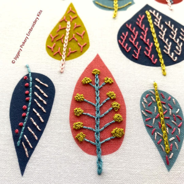 Close-up of stitching on modern leaf embroidery pattern