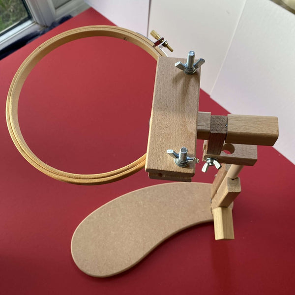 Embroidery lap stand holding a hoop