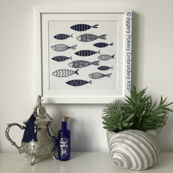 Jiggery Pokery blue fish embroidery pattern framed on wall