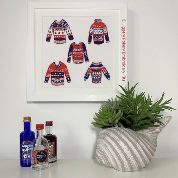 Jiggery Pokery Christmas jumpers embroidery kit framed on wall