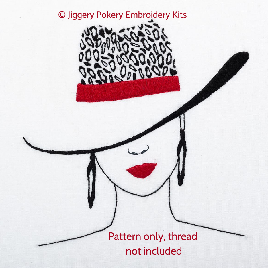 Leopard print embroidery pattern showing a woman wearing a black and red hat