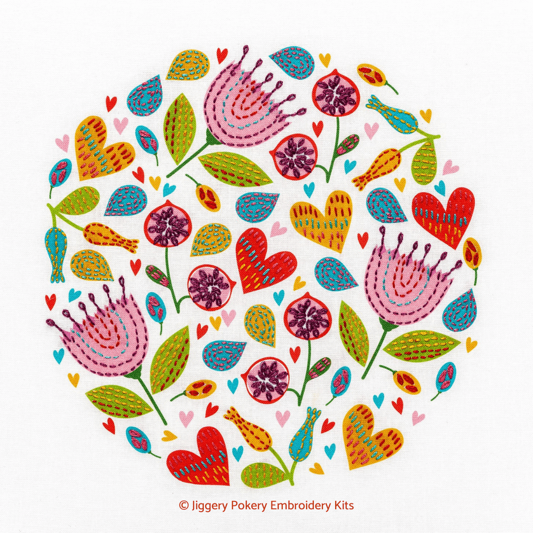 Modern floral embroidery kit with bright flowers and heart shapes in red, yellow, pink, purple and green