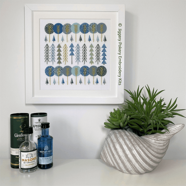 Simple trees embroidery kit framed on wall