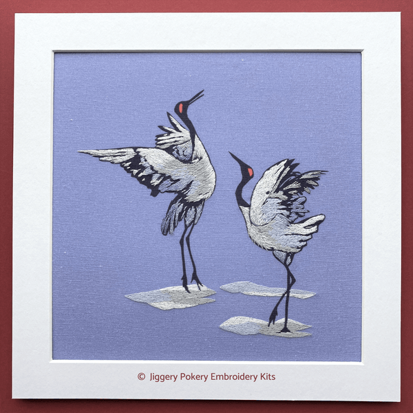 Thread painting embroidery pattern of dancing crane birds mounted